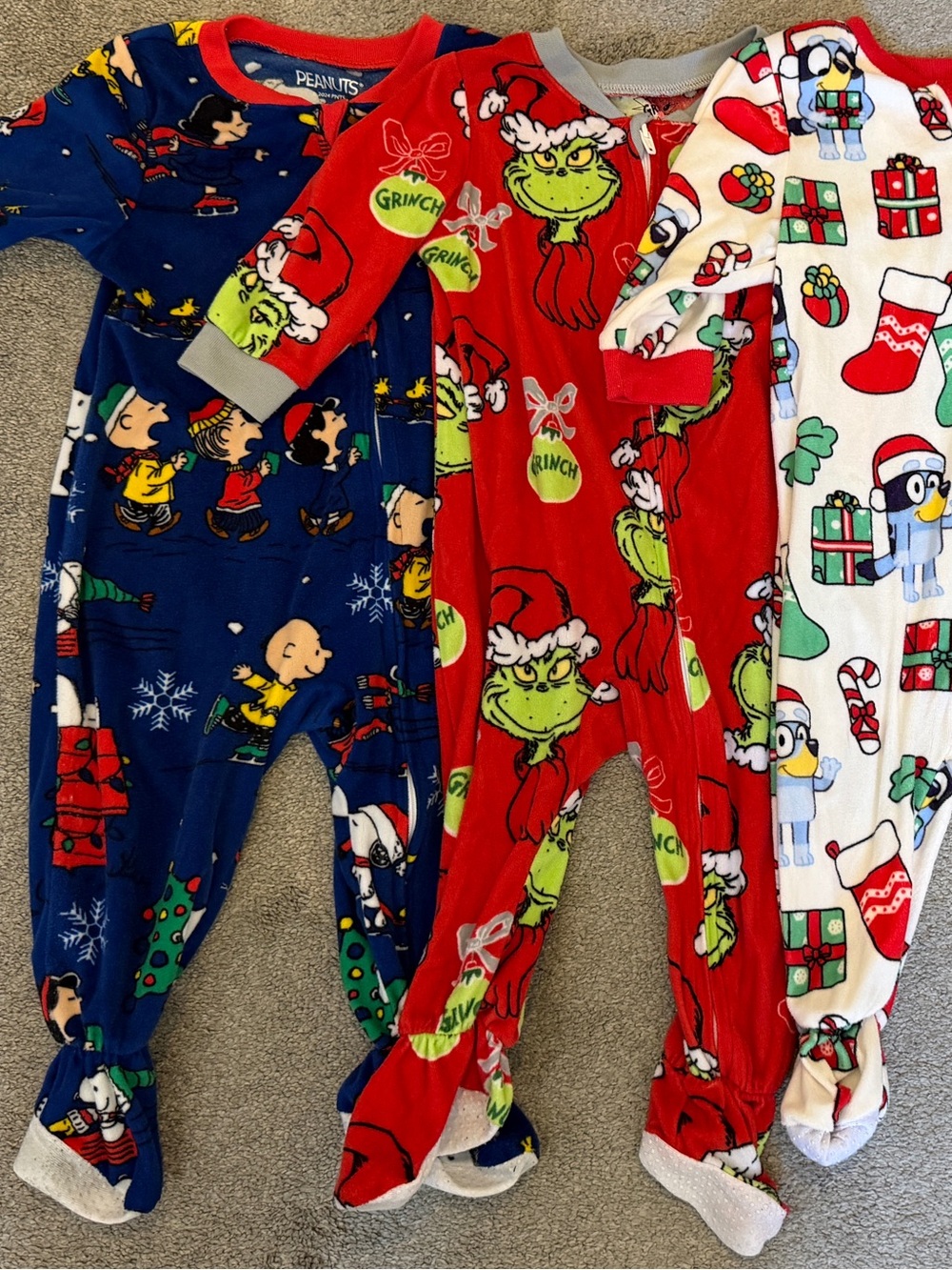 Kids Holiday One-Piece Pajamas - Red Grinch Print, Peanuts, and Bluey